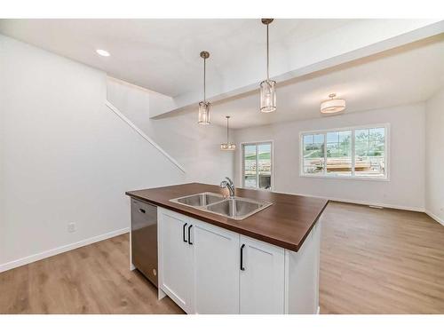 1481 Bayview Point, Airdrie, AB - Indoor Photo Showing Kitchen With Double Sink