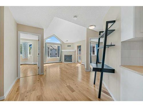 406-10 Sierra Morena Mews, Calgary, AB - Indoor With Fireplace