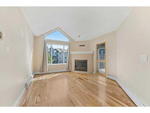 406-10 Sierra Morena Mews, Calgary, AB - Indoor Photo Showing Living Room With Fireplace