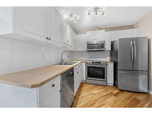 406-10 Sierra Morena Mews, Calgary, AB - Indoor Photo Showing Kitchen With Stainless Steel Kitchen With Double Sink