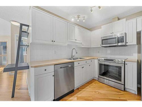 406-10 Sierra Morena Mews, Calgary, AB - Indoor Photo Showing Kitchen With Stainless Steel Kitchen With Double Sink