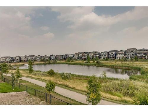 523 Kingsmere Way Se, Airdrie, AB - Outdoor With Body Of Water With View