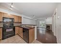 9118-70 Panamount Drive Nw, Calgary, AB  - Indoor Photo Showing Kitchen With Double Sink 