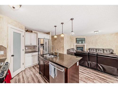 1351 Kings Heights Road Se, Airdrie, AB - Indoor Photo Showing Kitchen With Double Sink With Upgraded Kitchen