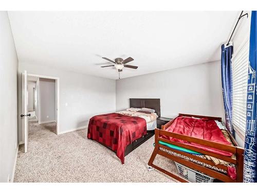 1351 Kings Heights Road Se, Airdrie, AB - Indoor Photo Showing Bedroom