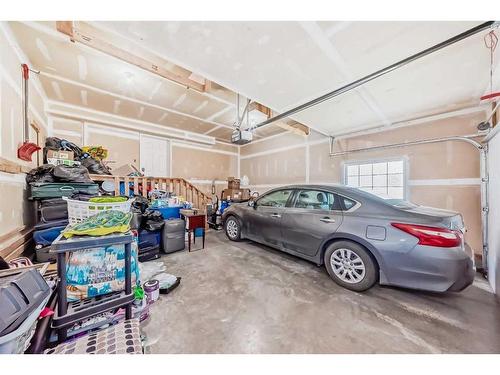 1351 Kings Heights Road Se, Airdrie, AB - Indoor Photo Showing Garage