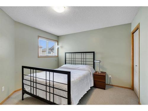 52 Panatella Gate Nw, Calgary, AB - Indoor Photo Showing Bedroom