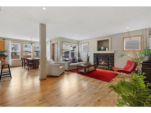 52 Panatella Gate Nw, Calgary, AB - Indoor Photo Showing Living Room With Fireplace