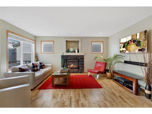 52 Panatella Gate Nw, Calgary, AB - Indoor Photo Showing Living Room With Fireplace