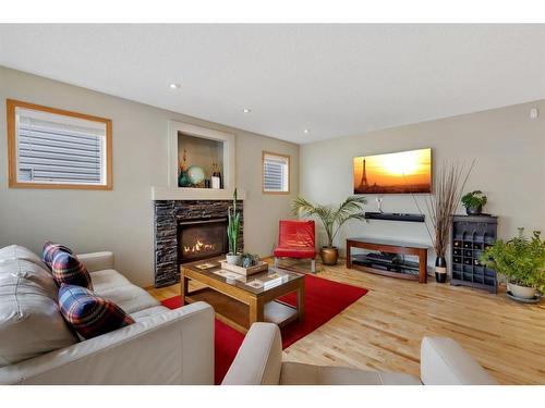 52 Panatella Gate Nw, Calgary, AB - Indoor Photo Showing Living Room With Fireplace