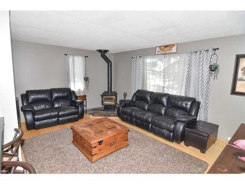 105 Cochrane Crescent, Cochrane, AB - Indoor Photo Showing Living Room With Fireplace