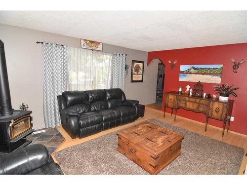 105 Cochrane Crescent, Cochrane, AB - Indoor Photo Showing Living Room With Fireplace