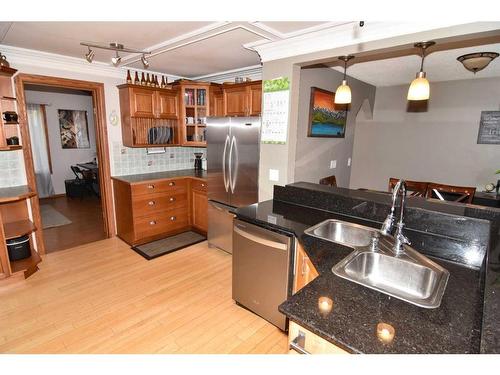 105 Cochrane Crescent, Cochrane, AB - Indoor Photo Showing Kitchen With Double Sink