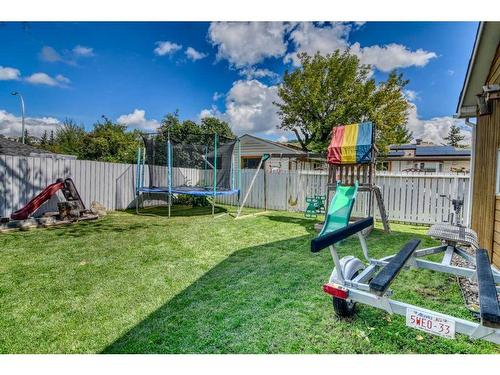 105 Cochrane Crescent, Cochrane, AB - Outdoor With Backyard