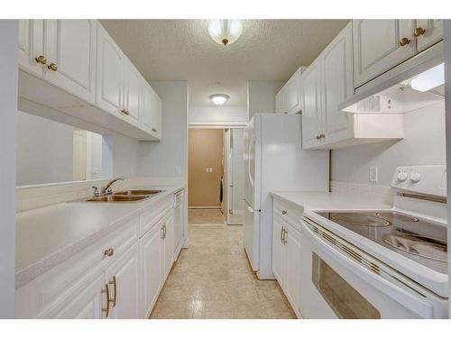 117-33 Arbour Grove Close Nw, Calgary, AB - Indoor Photo Showing Kitchen With Double Sink