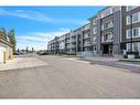 2302-6118 80 Avenue Ne, Calgary, AB  - Outdoor With Balcony With Facade 