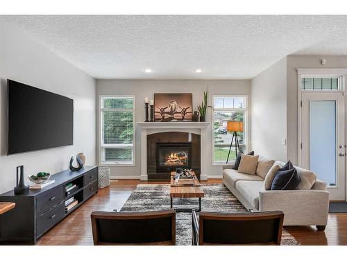 47 Hamptons Close Nw, Calgary, AB - Indoor Photo Showing Living Room With Fireplace