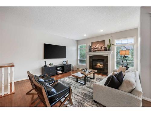 47 Hamptons Close Nw, Calgary, AB - Indoor Photo Showing Living Room With Fireplace