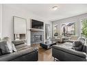 15 Brightoncrest Cove Se, Calgary, AB  - Indoor Photo Showing Living Room With Fireplace 