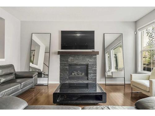 15 Brightoncrest Cove Se, Calgary, AB - Indoor Photo Showing Living Room With Fireplace