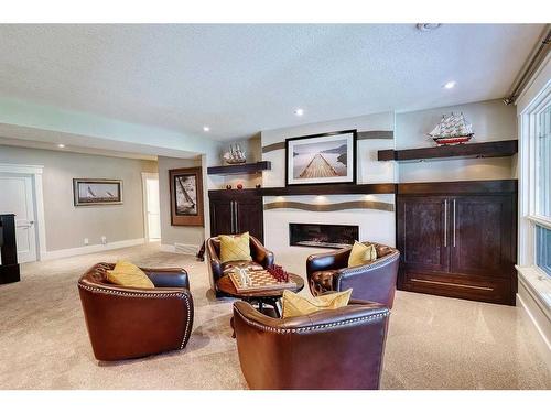 92 Hawk'S Landing Drive, Priddis Greens, AB - Indoor With Fireplace