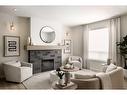 304 Edith Place Nw, Calgary, AB  - Indoor Photo Showing Living Room With Fireplace 