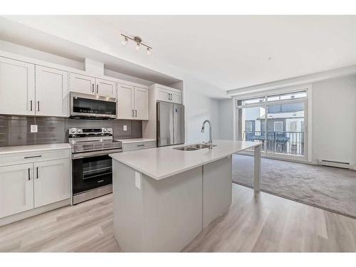 6212-200 Seton Circle Se, Calgary, AB - Indoor Photo Showing Kitchen With Stainless Steel Kitchen With Double Sink With Upgraded Kitchen