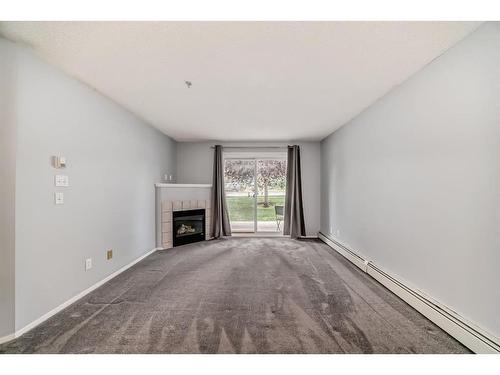 1107-1000 Somervale Court Sw, Calgary, AB - Indoor With Fireplace