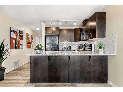 705-1410 1 Street Se, Calgary, AB - Indoor Photo Showing Kitchen With Upgraded Kitchen