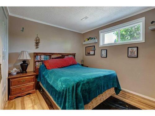 603 Anderson Crescent, Diamond Valley, AB - Indoor Photo Showing Bedroom