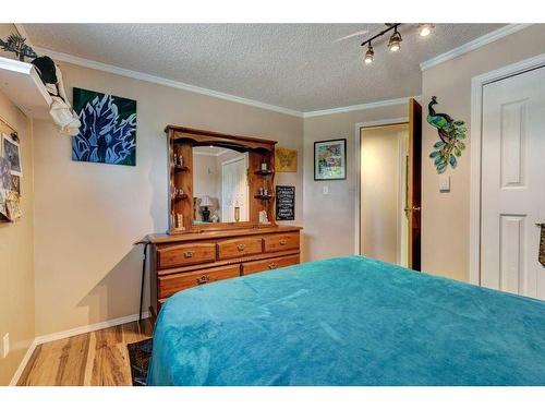 603 Anderson Crescent, Diamond Valley, AB - Indoor Photo Showing Bedroom