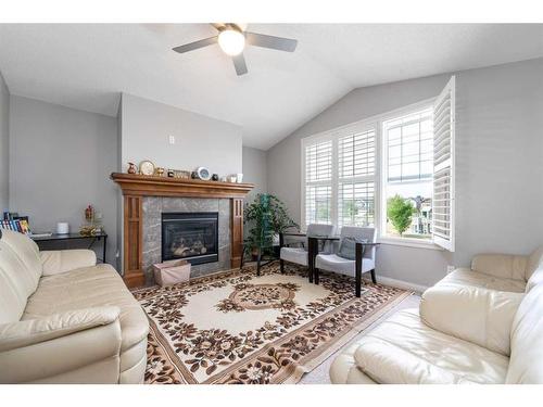 8 Aspen Hills Court Sw, Calgary, AB - Indoor Photo Showing Living Room With Fireplace