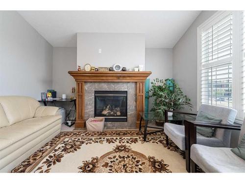 8 Aspen Hills Court Sw, Calgary, AB - Indoor Photo Showing Living Room With Fireplace