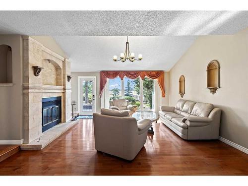 305 East Chestermere Drive, Chestermere, AB - Indoor Photo Showing Living Room With Fireplace