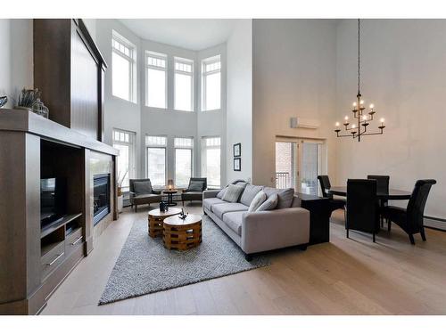 302-1407 Kensington Close Nw, Calgary, AB - Indoor Photo Showing Living Room With Fireplace