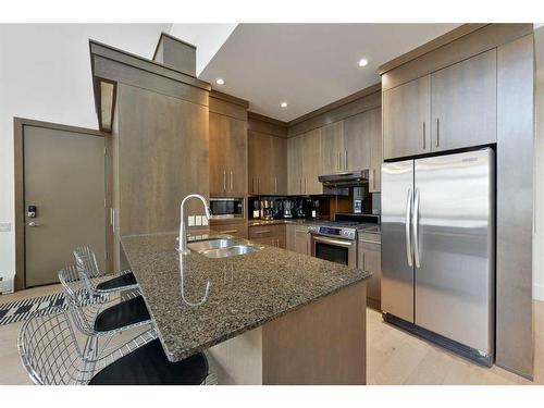 302-1407 Kensington Close Nw, Calgary, AB - Indoor Photo Showing Kitchen With Stainless Steel Kitchen With Double Sink