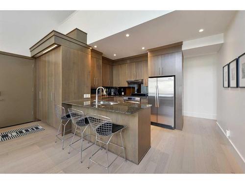 302-1407 Kensington Close Nw, Calgary, AB - Indoor Photo Showing Kitchen With Stainless Steel Kitchen With Double Sink