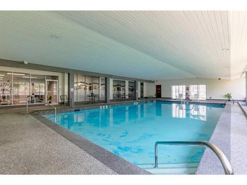 405-4944 Dalton Drive Nw, Calgary, AB - Indoor Photo Showing Other Room With In Ground Pool