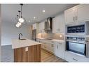 2107-55 Lucas Way Nw, Calgary, AB  - Indoor Photo Showing Kitchen With Upgraded Kitchen 