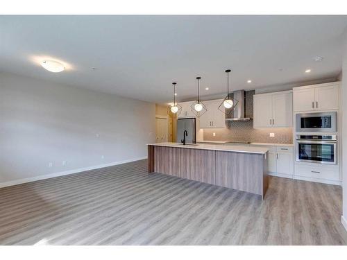 2107-55 Lucas Way Nw, Calgary, AB - Indoor Photo Showing Kitchen With Upgraded Kitchen