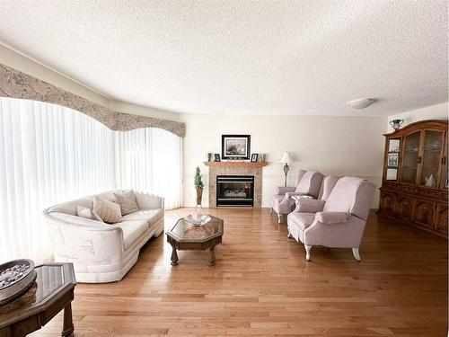 193 Balsam Crescent, Olds, AB - Indoor Photo Showing Living Room With Fireplace