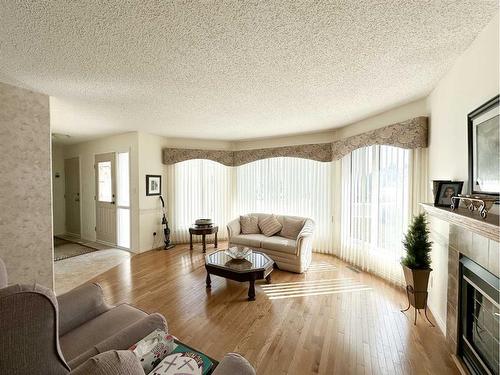 193 Balsam Crescent, Olds, AB - Indoor Photo Showing Living Room With Fireplace