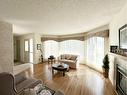 193 Balsam Crescent, Olds, AB  - Indoor Photo Showing Living Room With Fireplace 