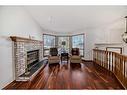 4 Bow Court, Cochrane, AB  - Indoor Photo Showing Living Room With Fireplace 