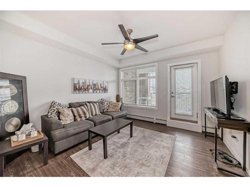 2111-3727 Sage Hill Drive Nw, Calgary, AB - Indoor Photo Showing Living Room