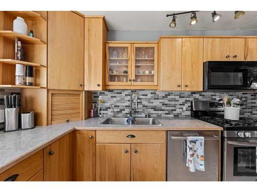 4421 55 Avenue, Olds, AB - Indoor Photo Showing Kitchen With Double Sink