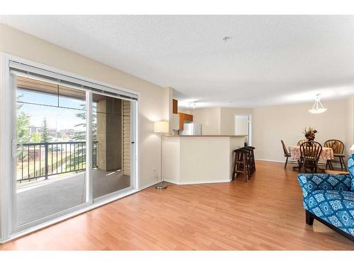 1232-8810 Royal Birch Boulevard Nw, Calgary, AB - Indoor Photo Showing Living Room