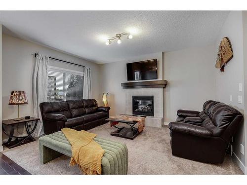 1338 Kings Heights Way Se, Airdrie, AB - Indoor Photo Showing Living Room With Fireplace