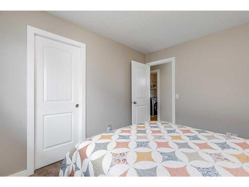 1338 Kings Heights Way Se, Airdrie, AB - Indoor Photo Showing Bedroom