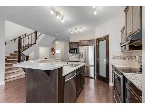 1338 Kings Heights Way Se, Airdrie, AB - Indoor Photo Showing Kitchen With Double Sink With Upgraded Kitchen